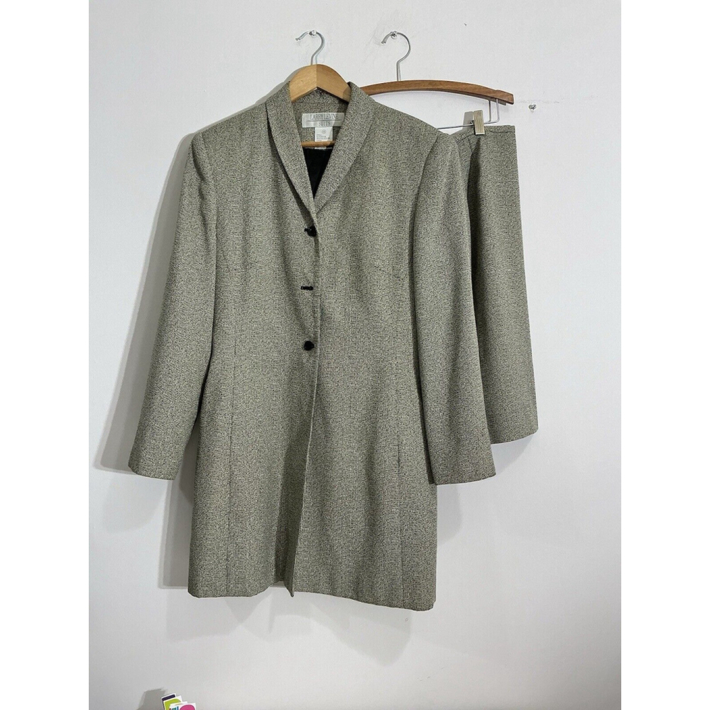 Chic Women's Black and cream 2 piece suit with long jacket and skirt.